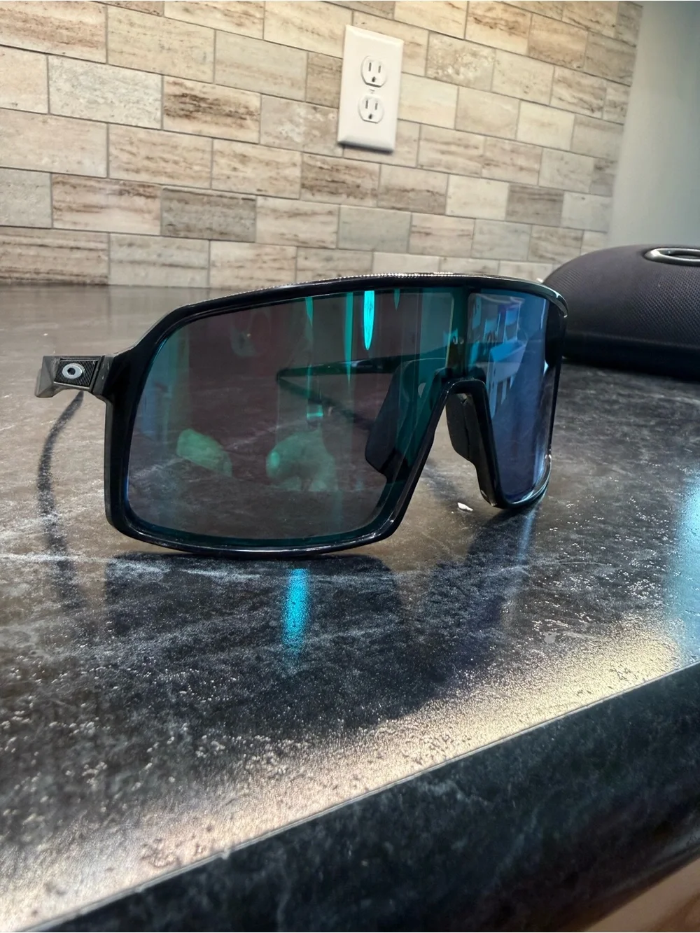 Oakley Matte Black Shield Sunglasses with Blue-Green Mirror Lenses
